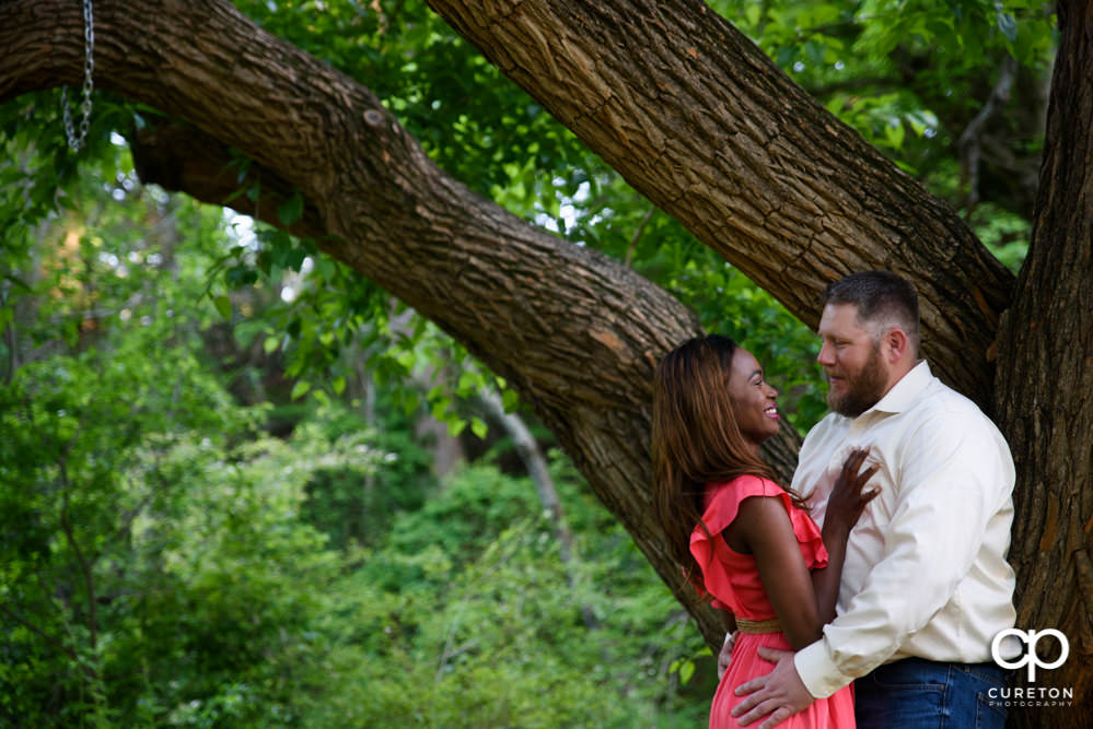 Engaged couple in a a downtown Greenville park.