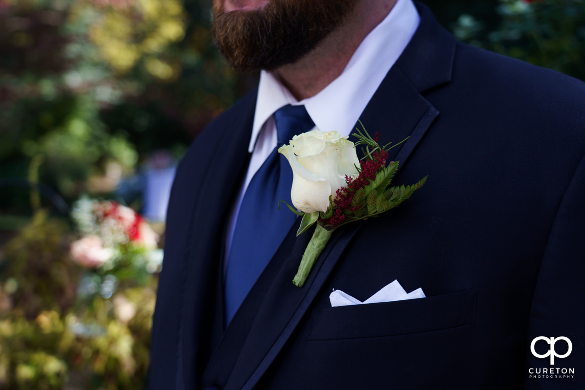 Grooms jacket and boutonniere.