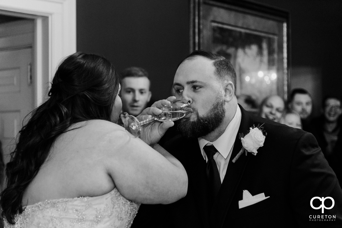 Bride and groom toasting.