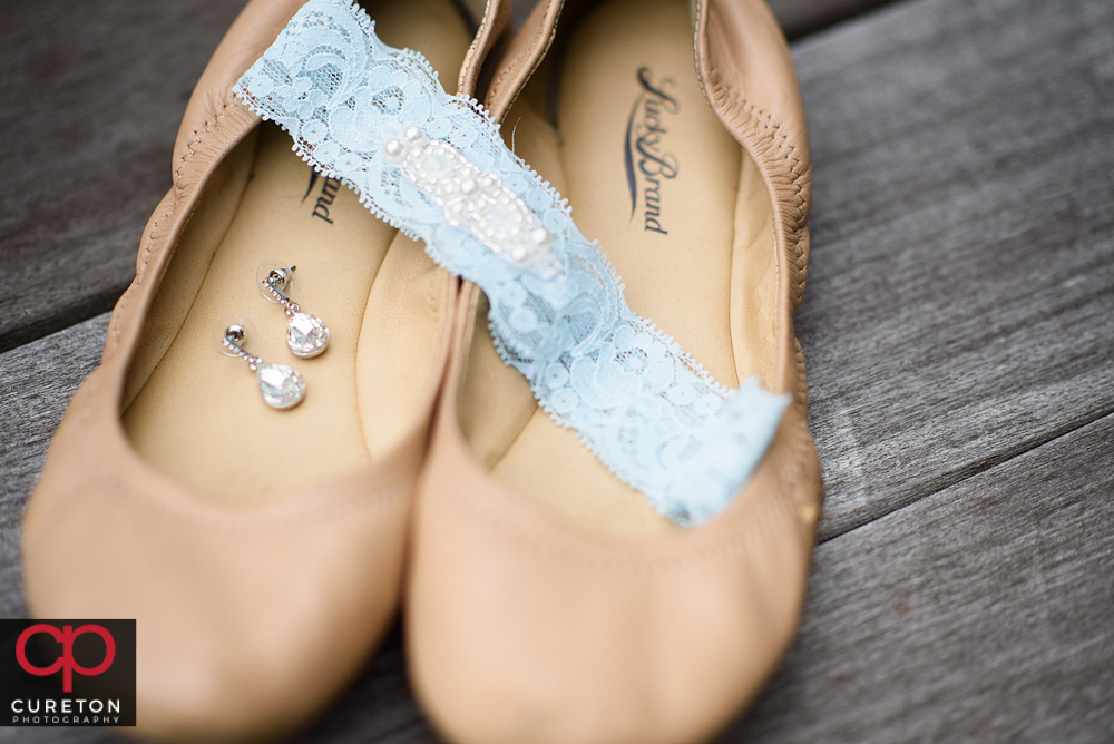 Bride's shoes and jewelry.