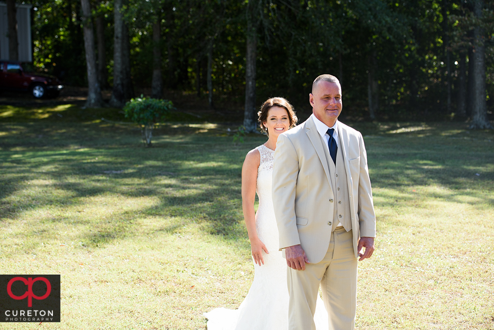 Bride having a first look with her father.