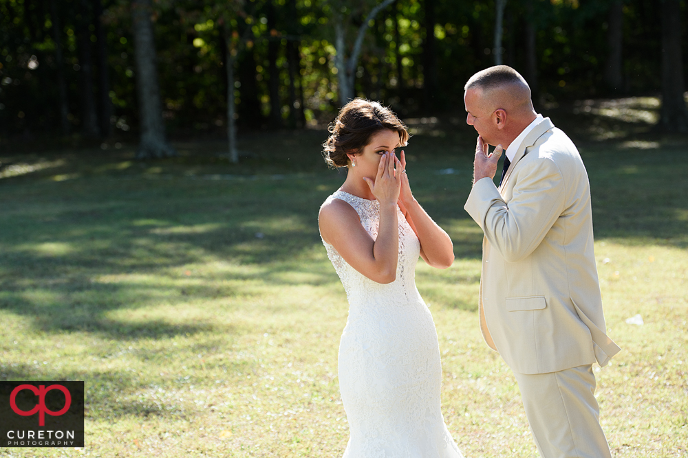 Bride crying during the first look with her father.