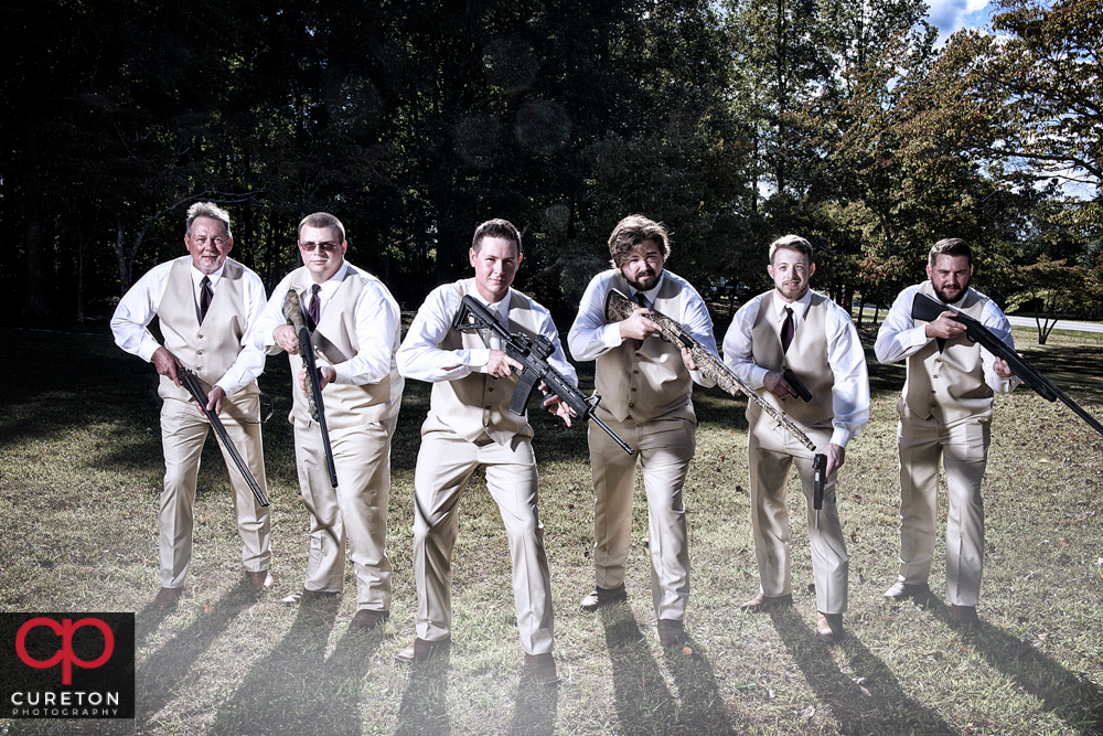 Groomsmen with guns.