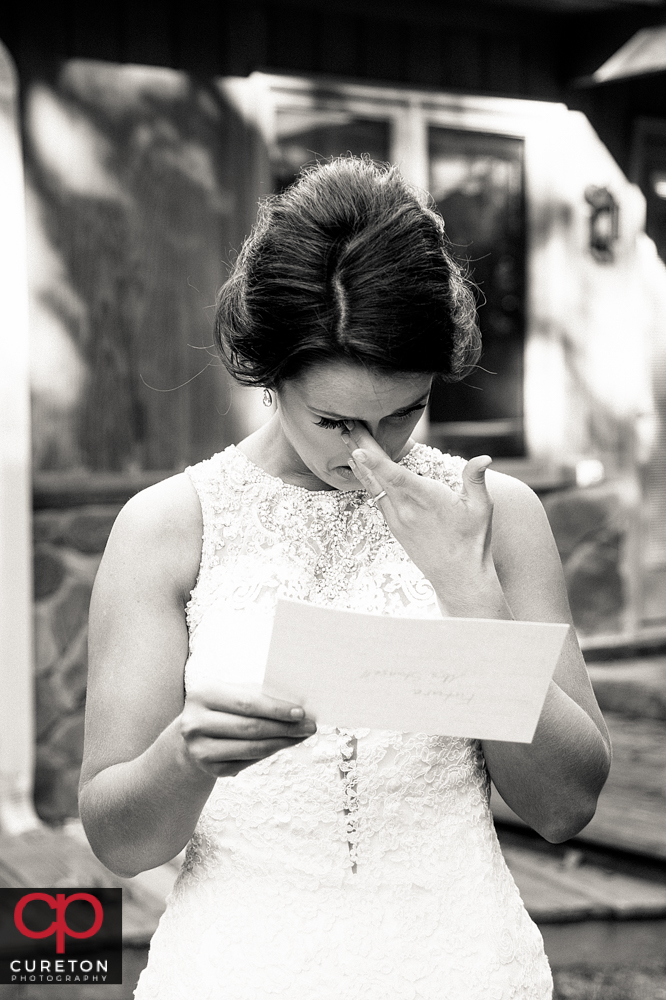 Bride reads a letter from her groom.