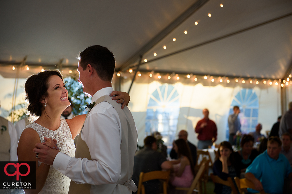 Bride smiling during the first dance.