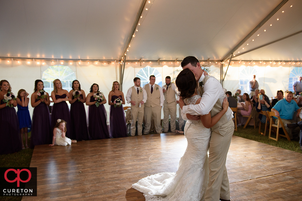 Groom kissing his bride during the first dance.