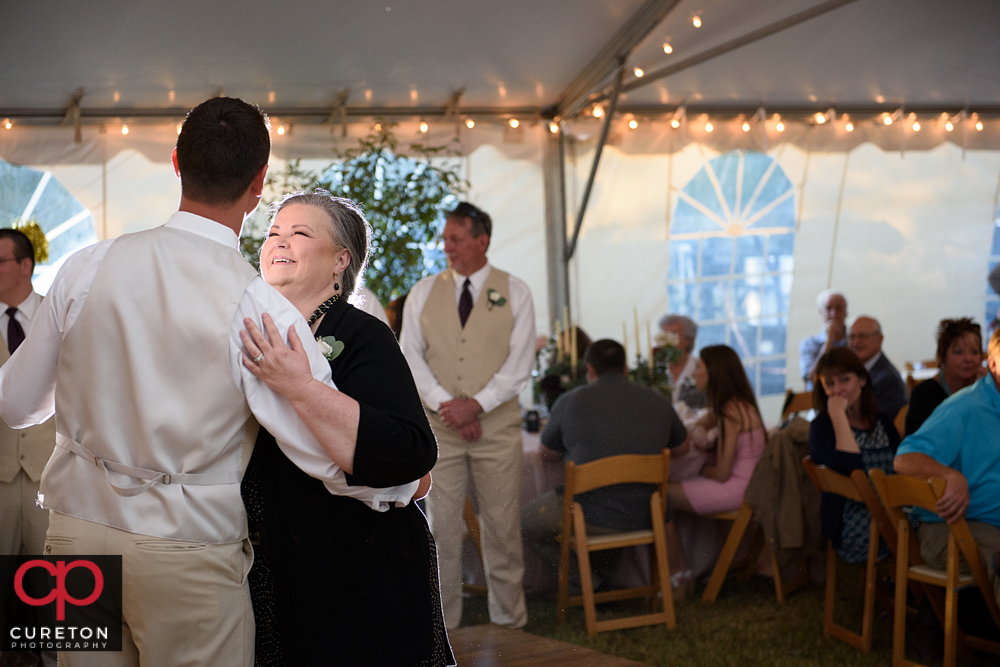 Groom and his mother dancing.