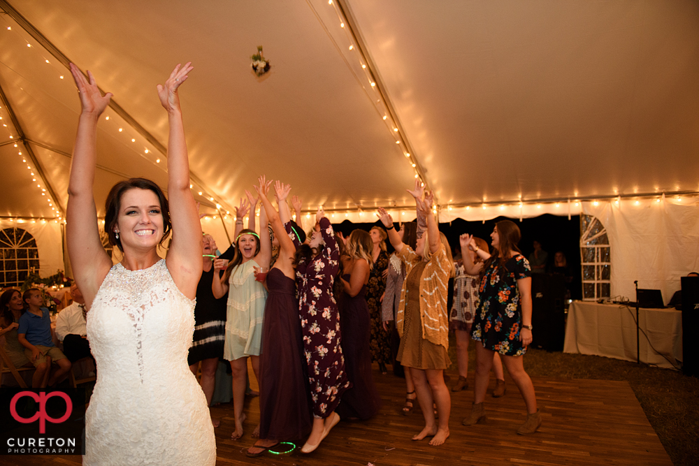Bride throwing the bouquet.