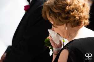Grandmother crying at the wedding.