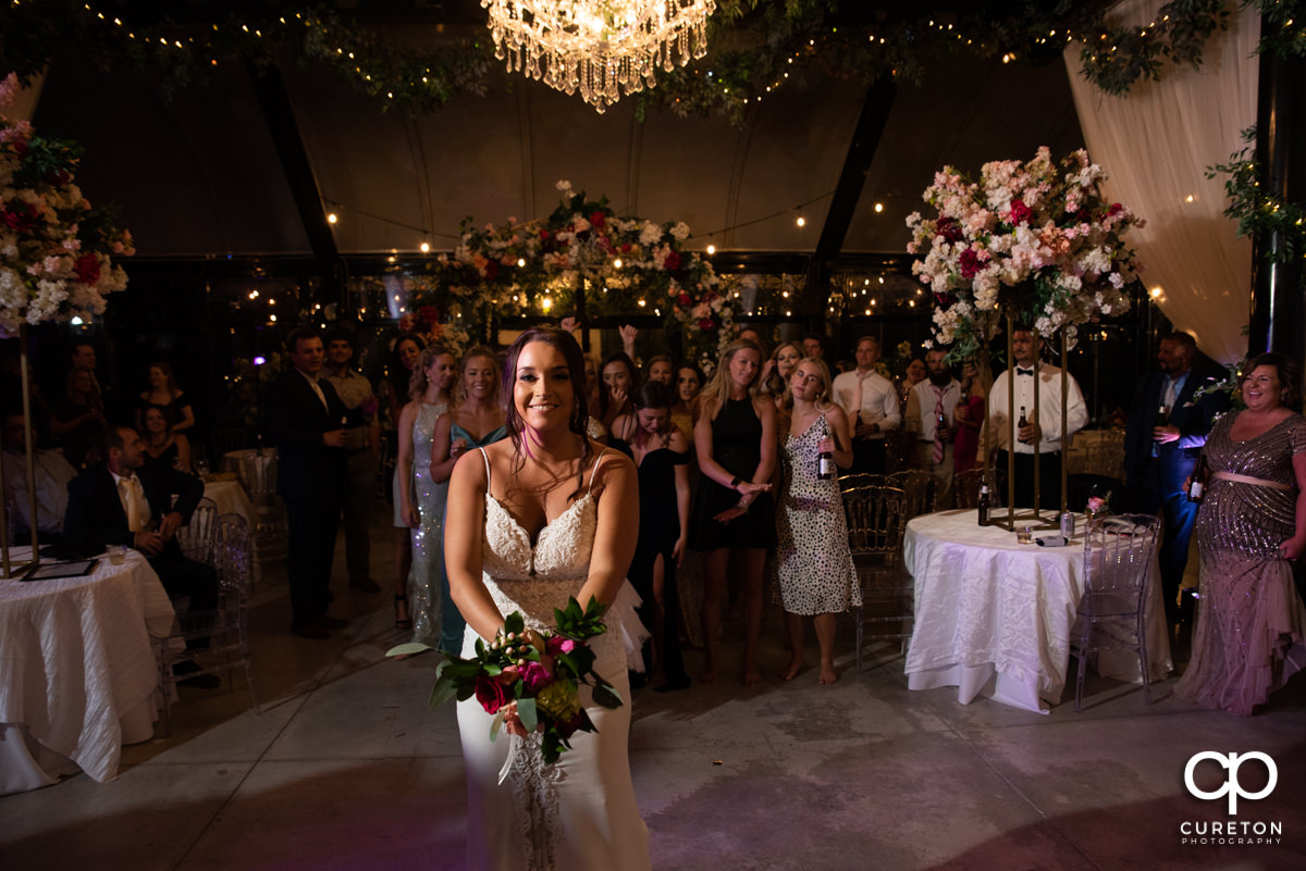Bride tossing her bouquet.