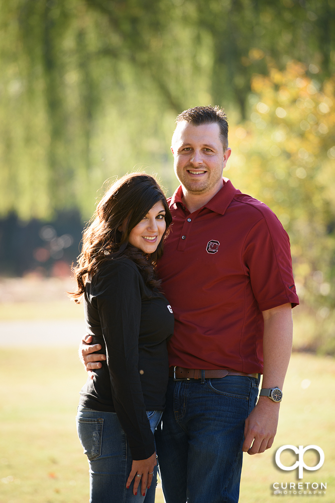 Engaged couple wearing South Carolina gamecock shirts.