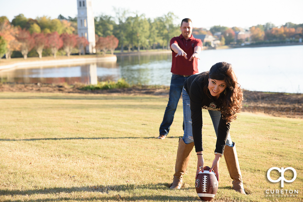 Woman hiking the ball to her fiancé.