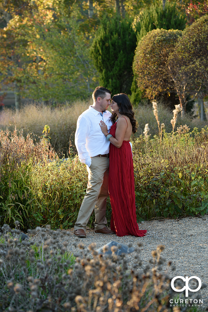 Engaged couple in the garden at Furman university.