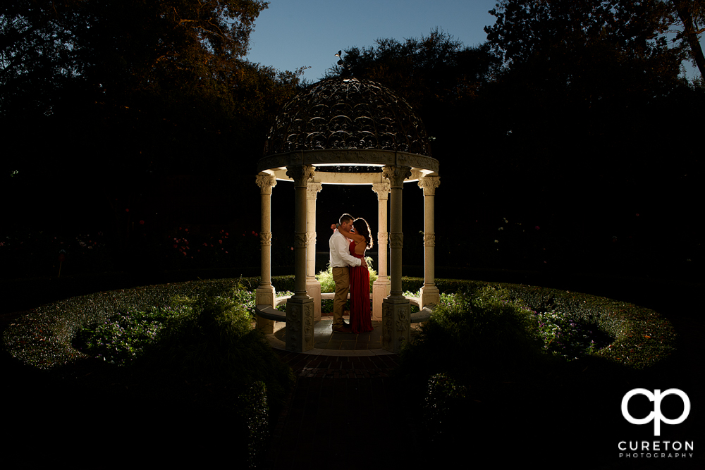 Couple standing in the rose garden during their Furman university engagement session.