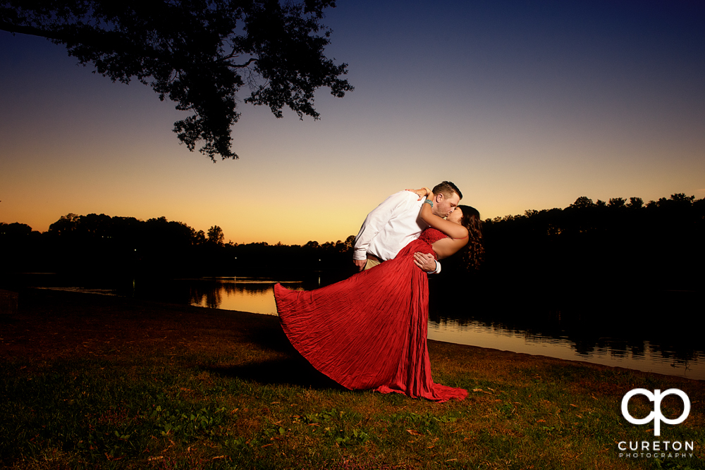 Groom dipping his future bride.