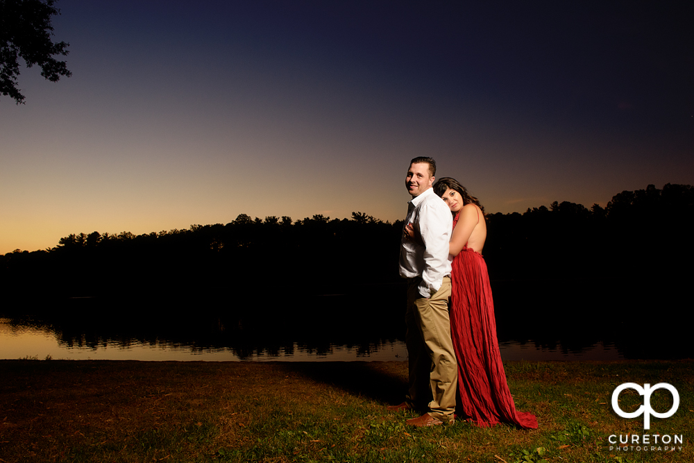 Engaged couple at sunset on the campus of Furman university.
