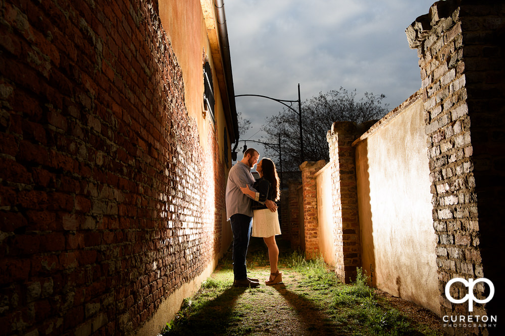 Man hugging his fiancee during a n engagement session in Greenville,SC.