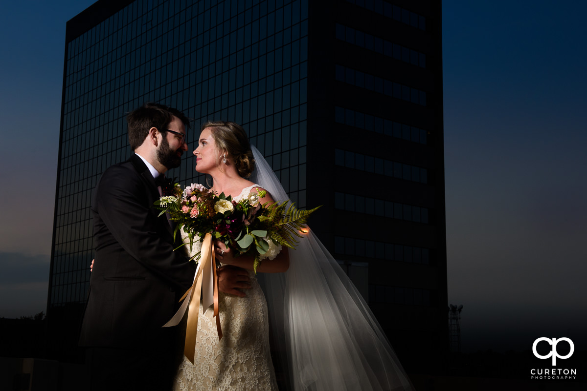 Bride and groom on a rooftop at The Commerce Club.