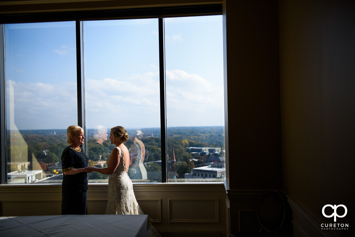 Bride and her mother share a moment 17 floors up at The Commerce Club before the wedding ceremony.