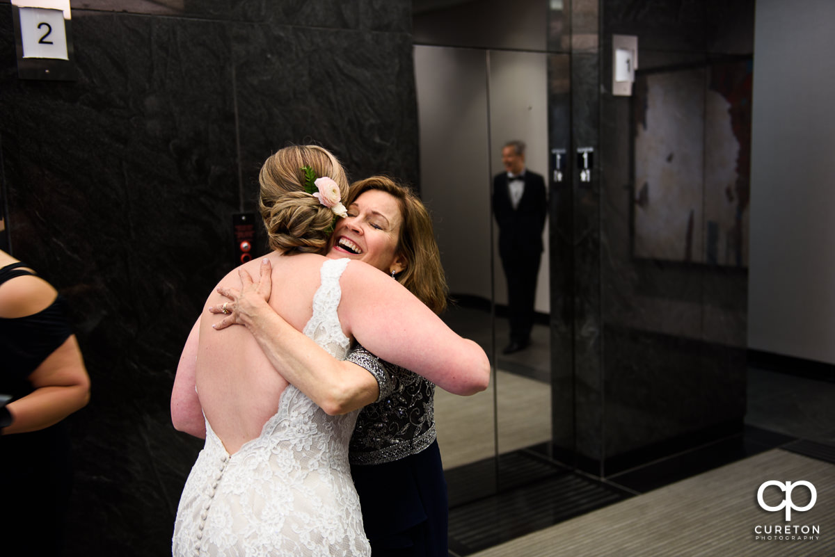 Bride hugging her future mother in law.