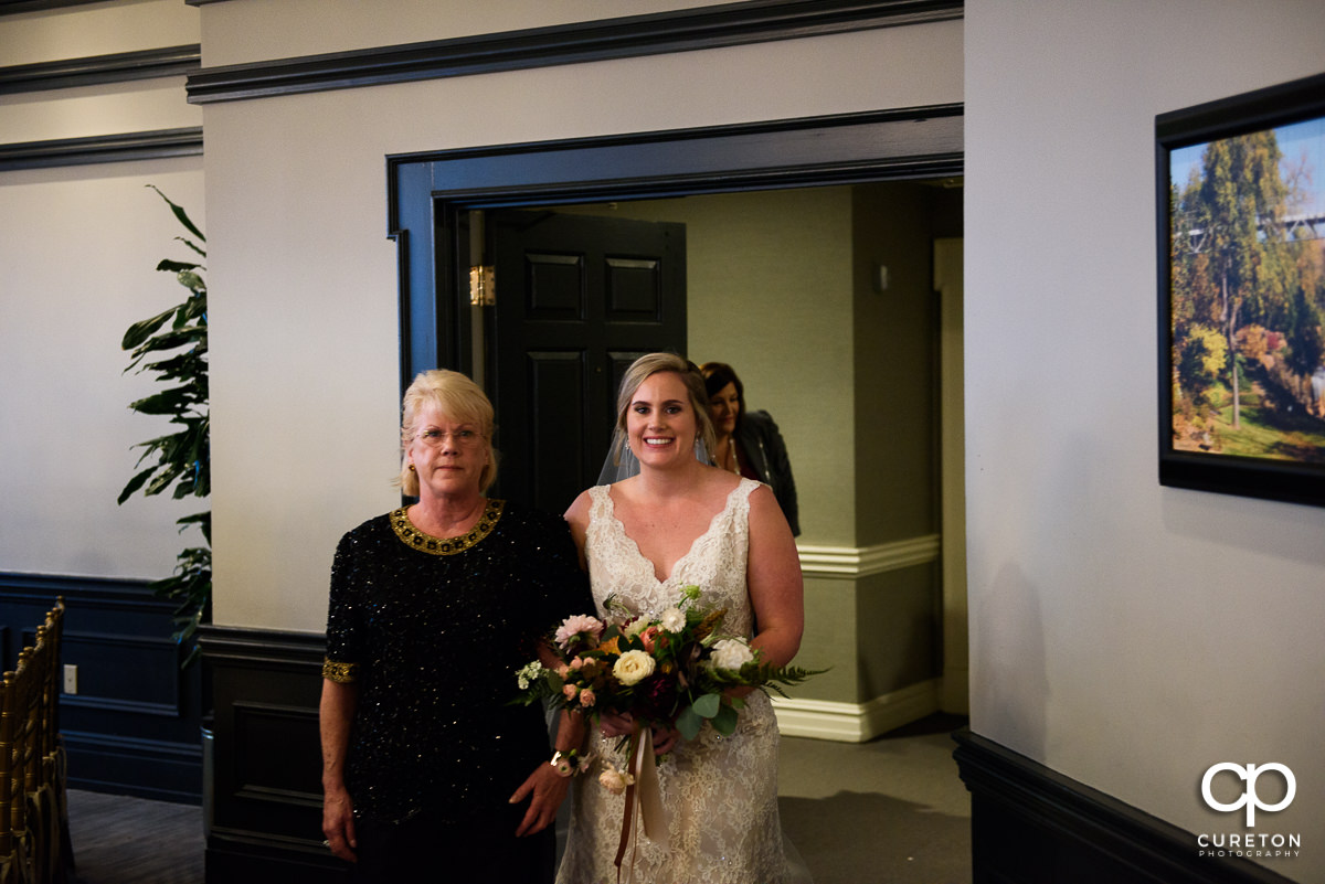 Bride and her mom entering the wedding ceremony.