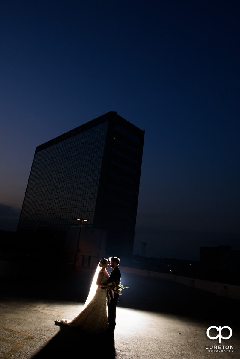 Bride and groom at sunset on the roof of the Commerce Club in Greenville,SC.