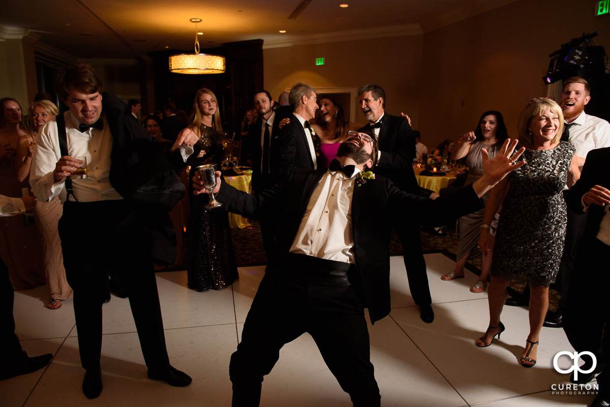 Wedding guests dancing at The Commerce Club reception.
