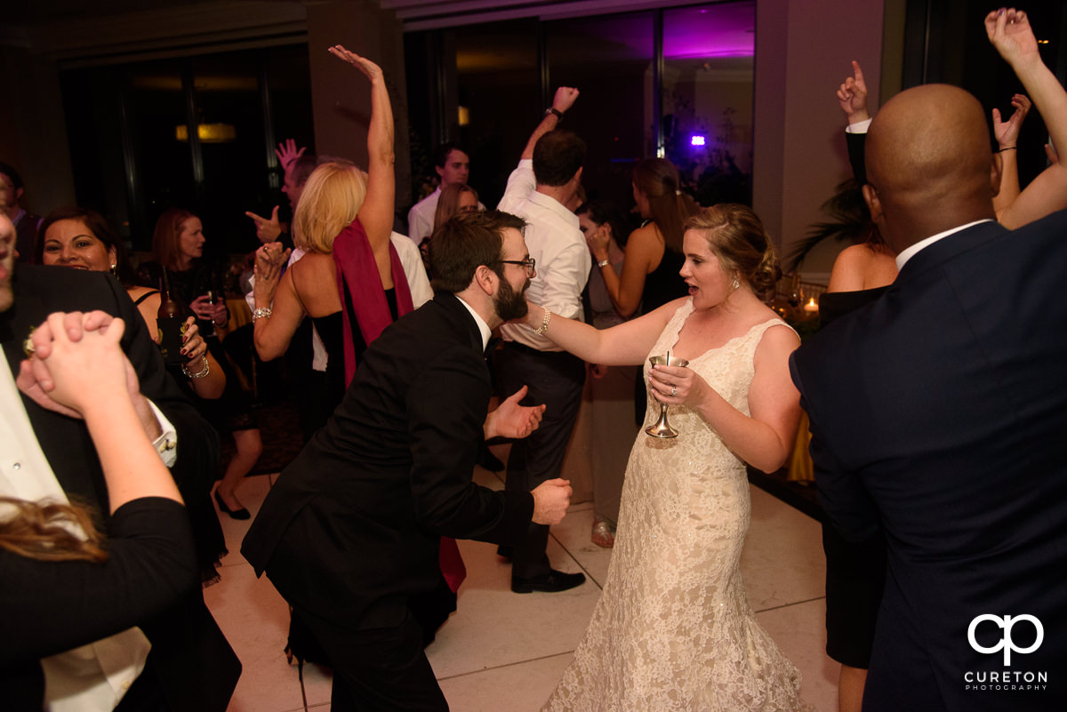 Wedding guests dancing at The Commerce Club reception.