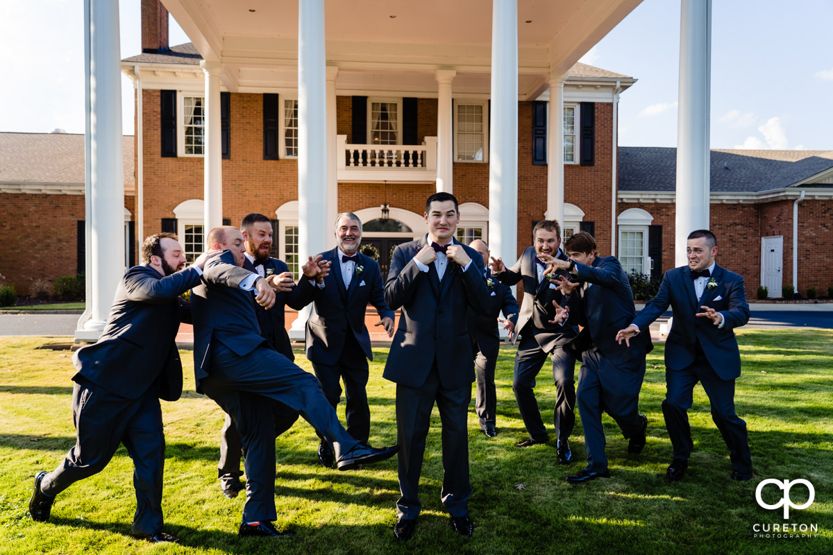 Groomsmen attacking the groom before the wedding.