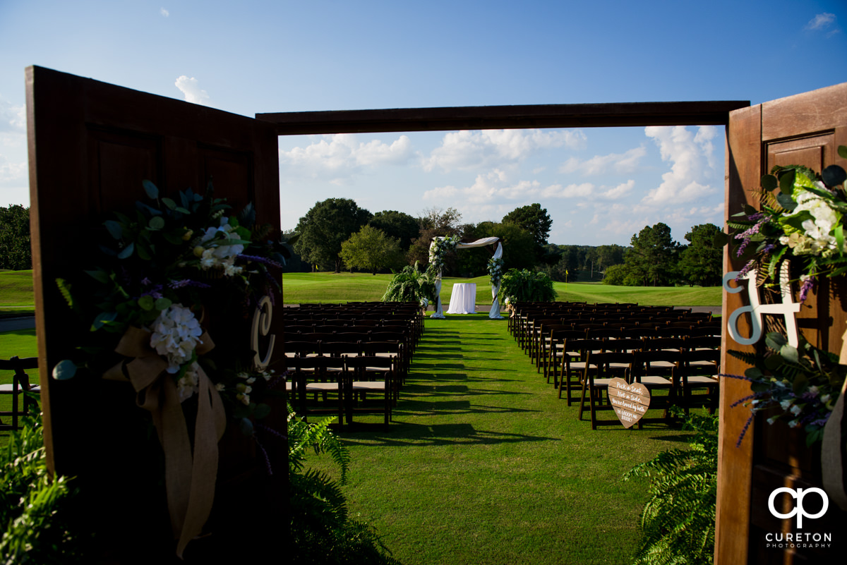 Wedding ceremony setup on the golf course at Holly Tree.