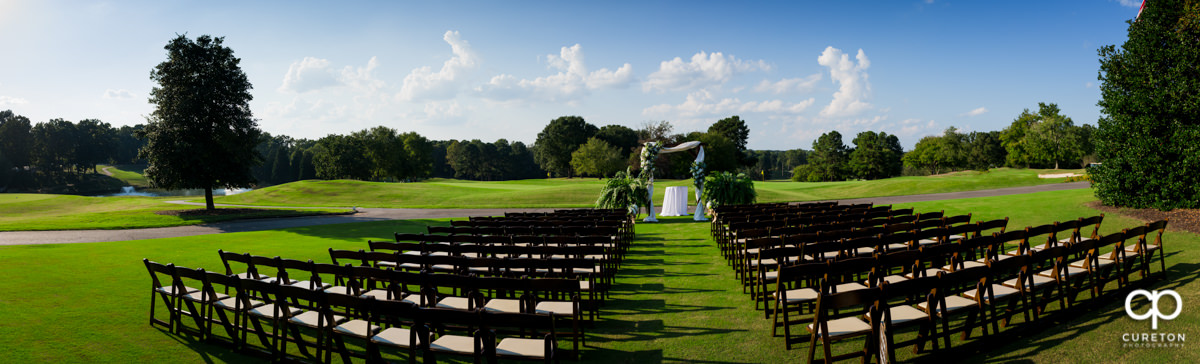 Wedding ceremony setup on the golf course at Holly Tree.
