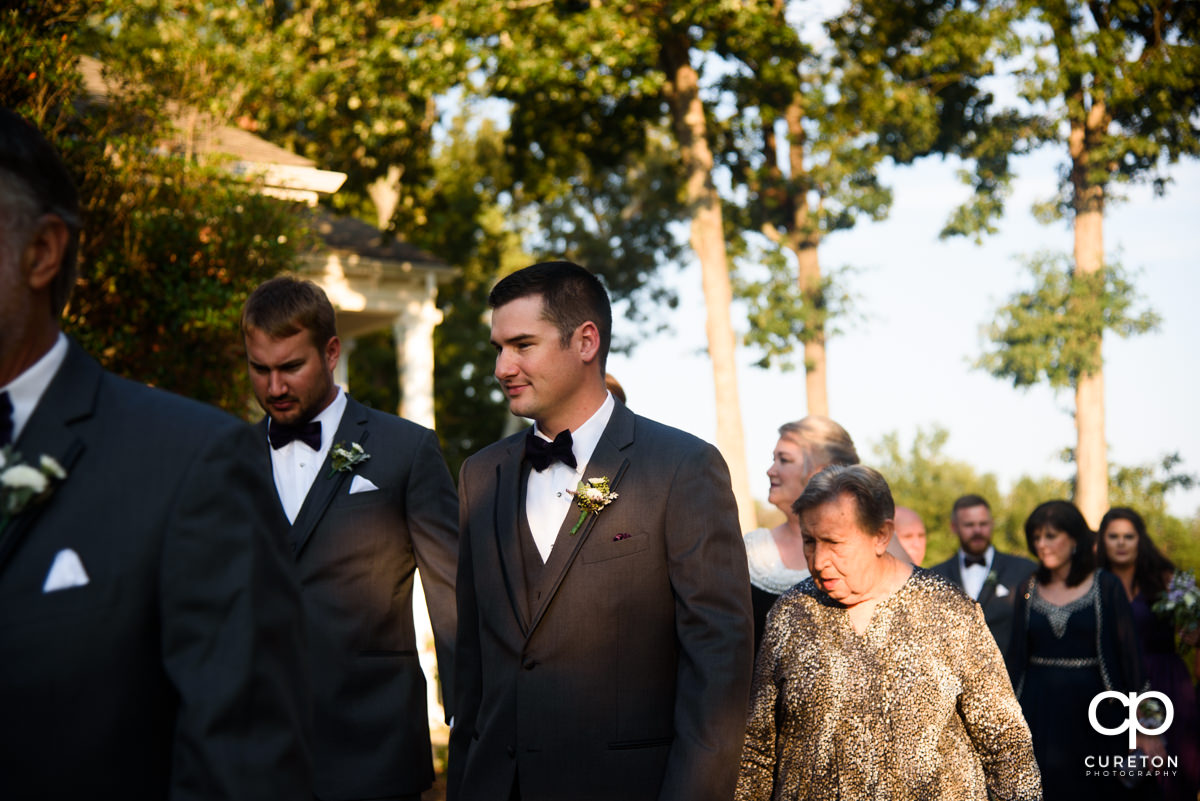 Groom walking to the ceremony.