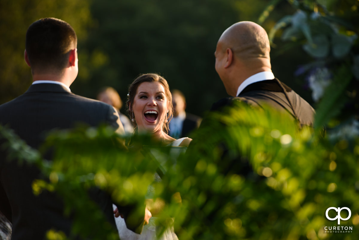 Bride laughing during her Holly Tree wedding.