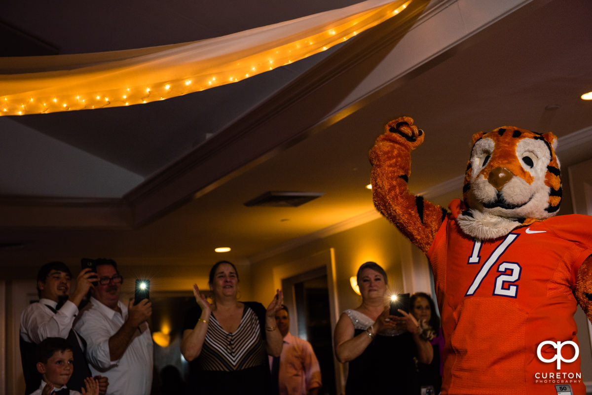 Clemson Tiger Cub cheering at the wedding reception.