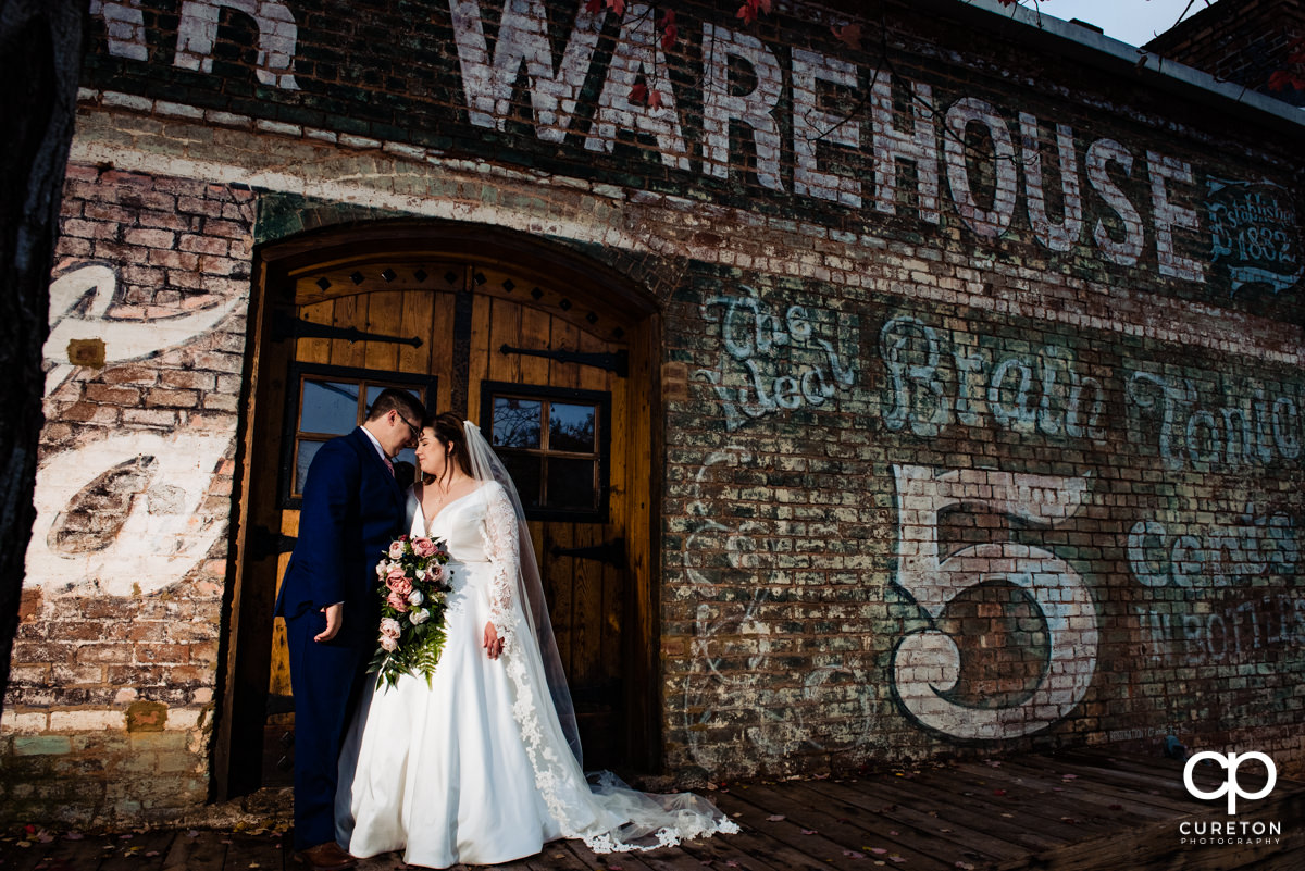 Bride and groom on the back deck at the old cigar warehouse.