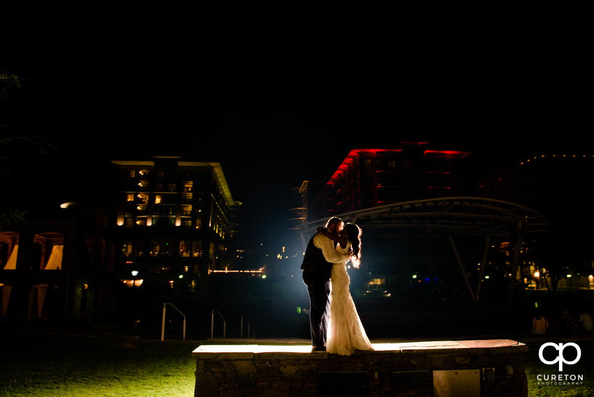 Bride and groom dancing outside of Larkin's on the River during their wedding reception.