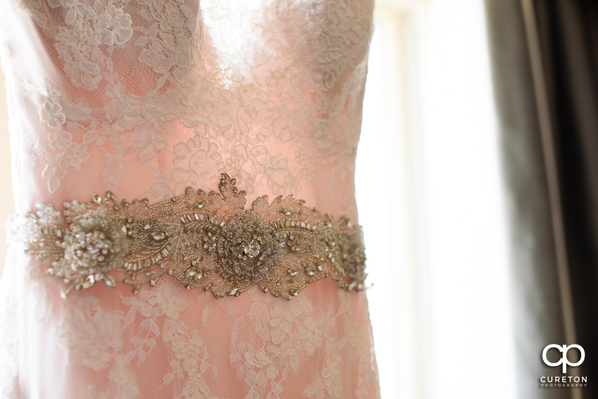 Detail on the bride's dress.