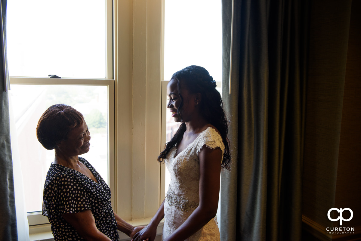 Bride and her mom have a moment before the wedding at The Westin Poinsett Hotel.