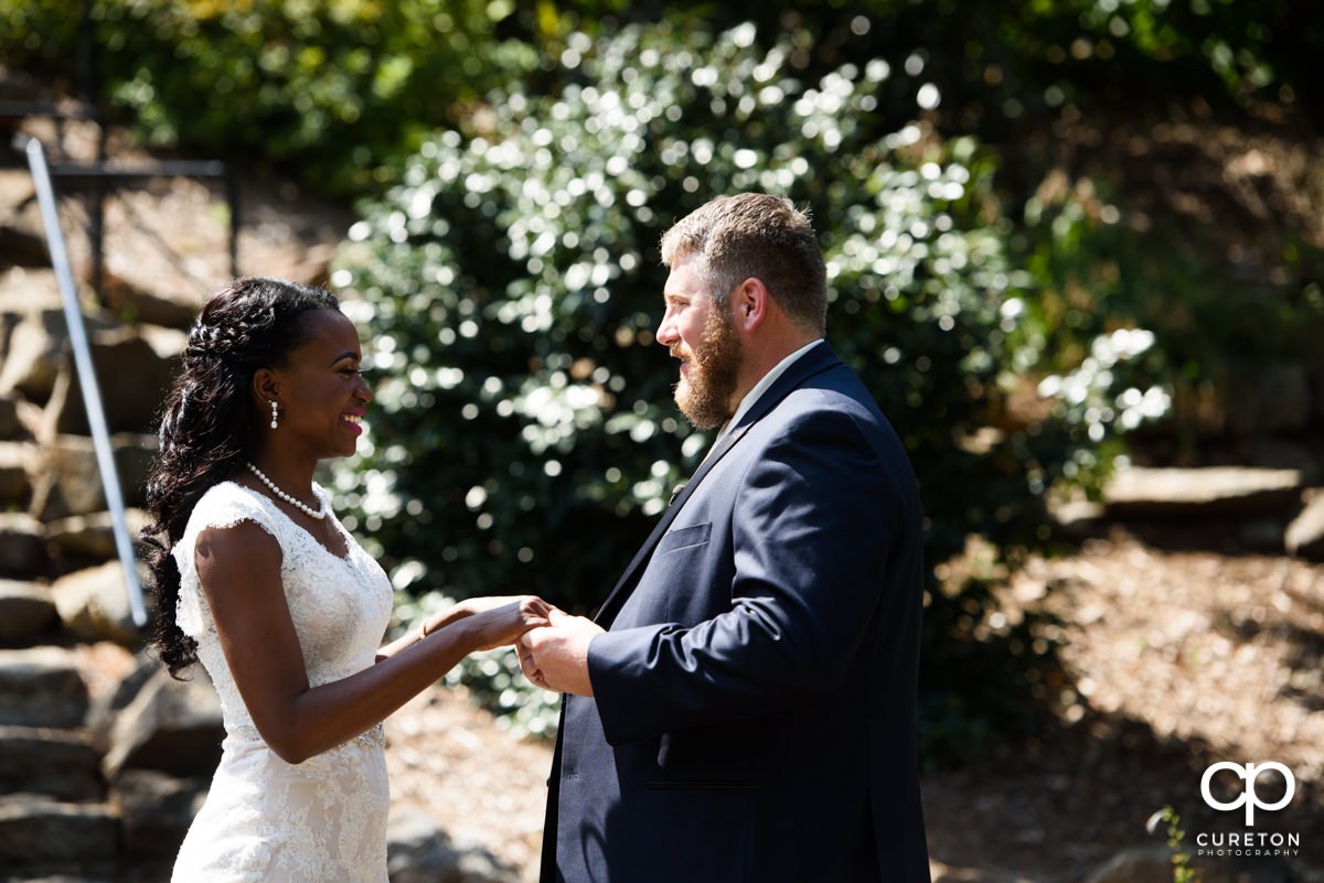 Bride and groom first look at the Rock Quarry Garden.