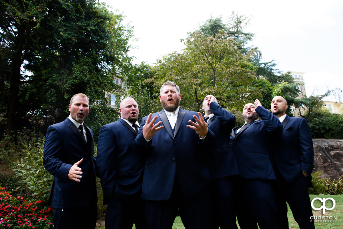 Groomsmen having fun at the Rock Quarry Garden.