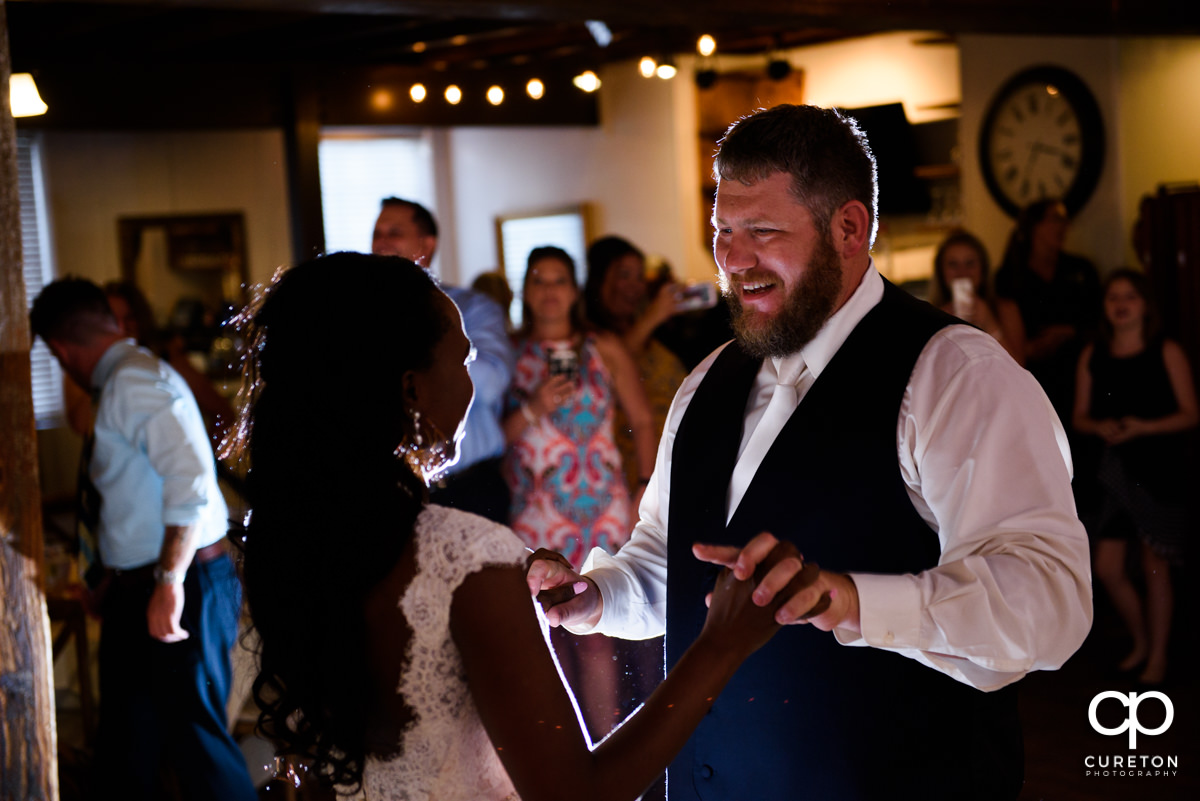 Groom smiling during the first dance.