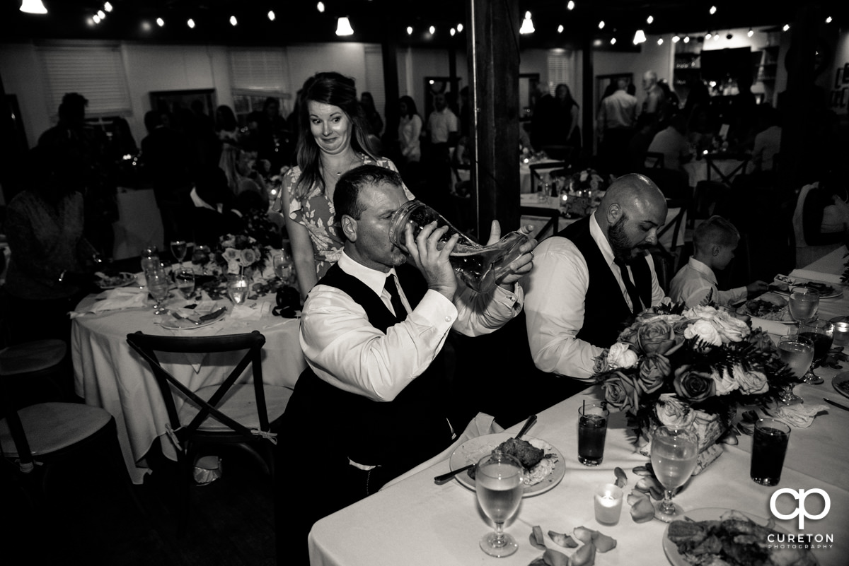 Wedding Party drinking out of Das Boot.