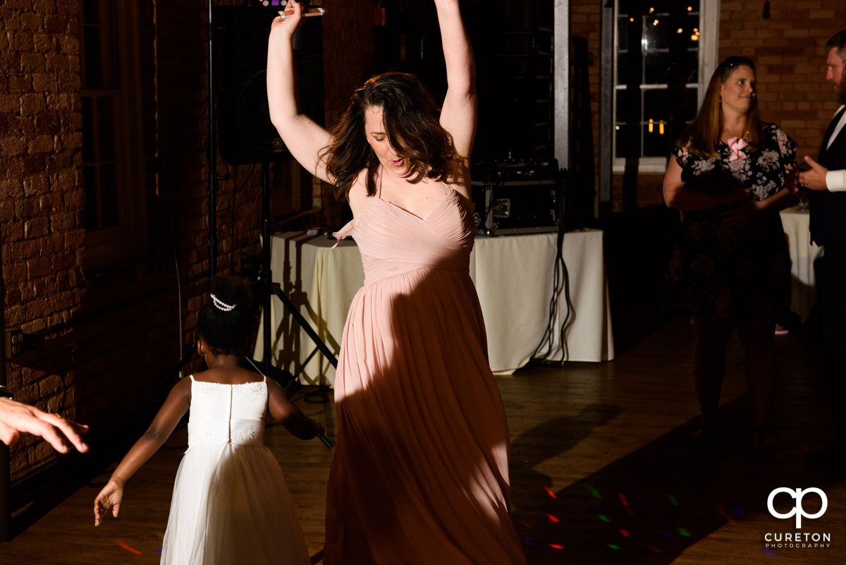 Bridesmaids dancing.
