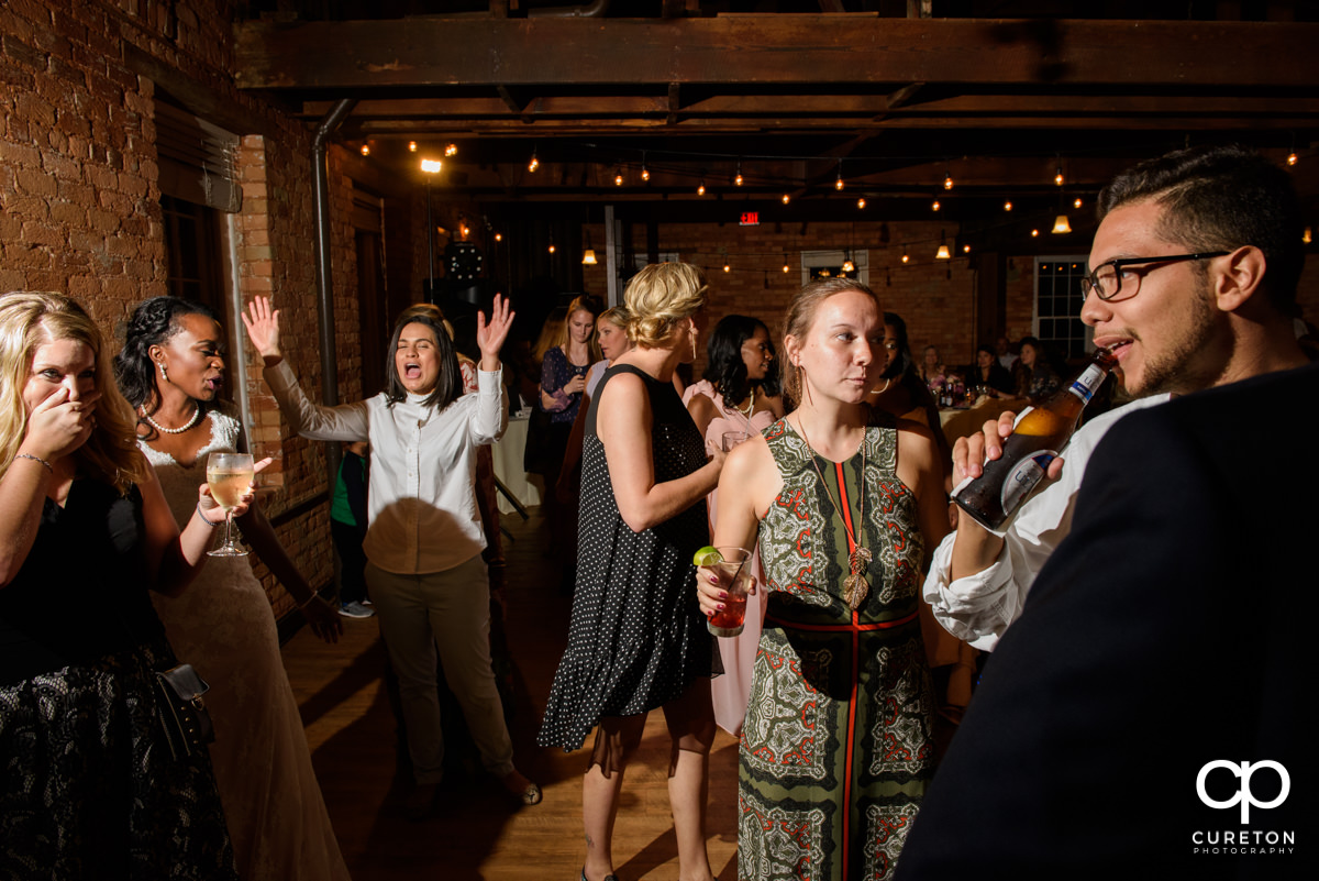Wedding guests dancing .