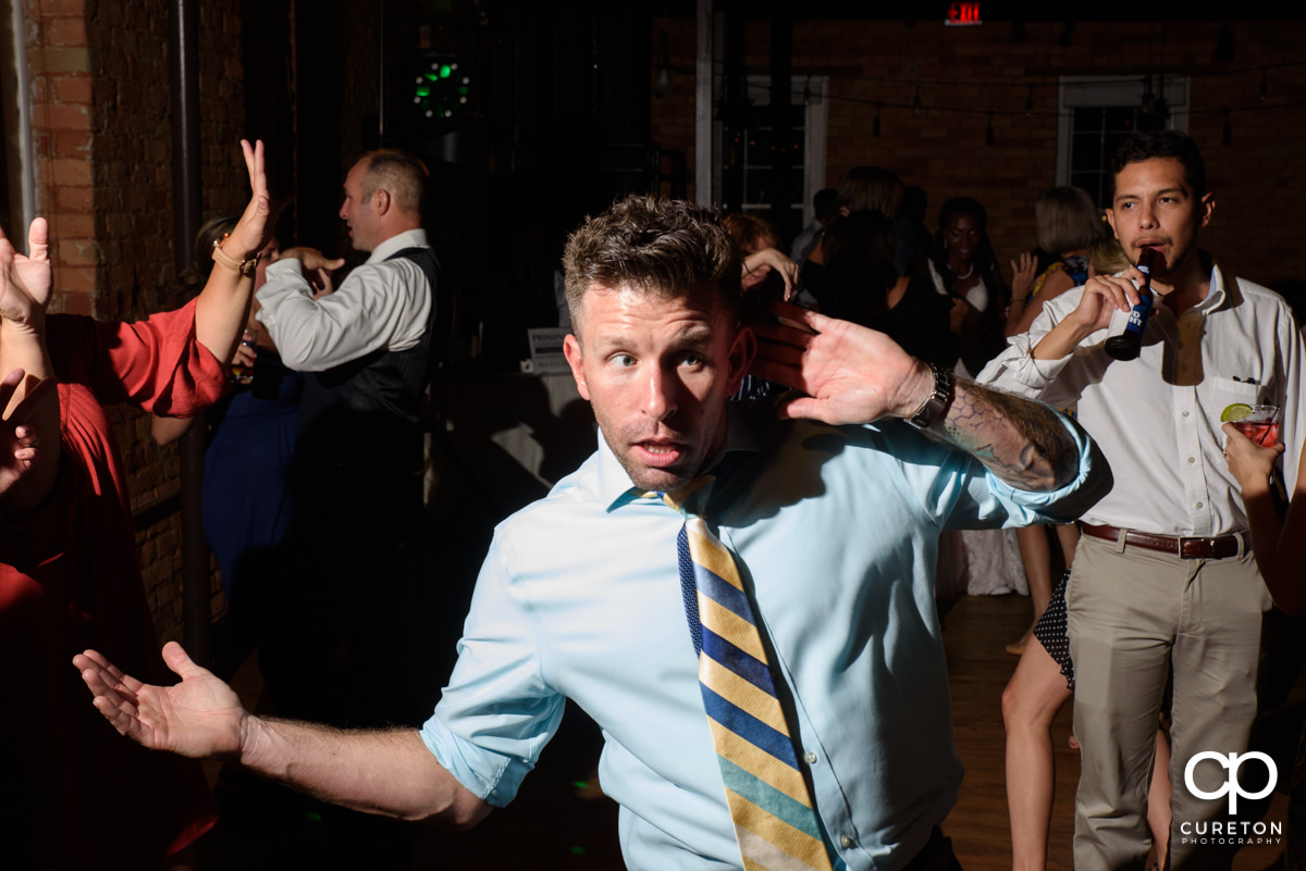 Wedding guest dancing.