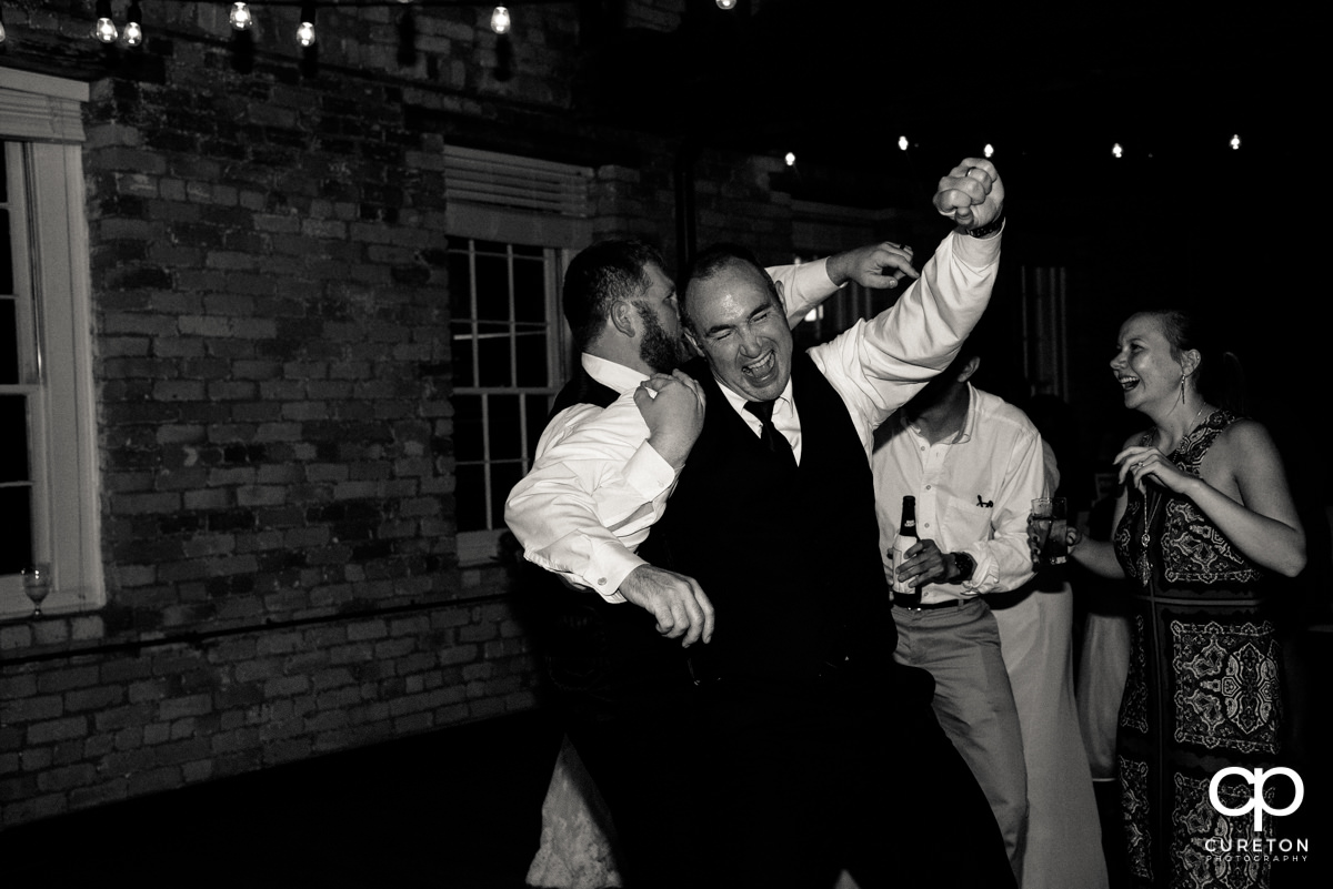 Groomsmen dancing.