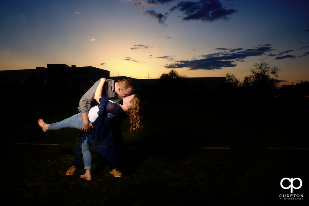 Future bride and groom having an engagement session in downtown Greenville SC at Falls Park.