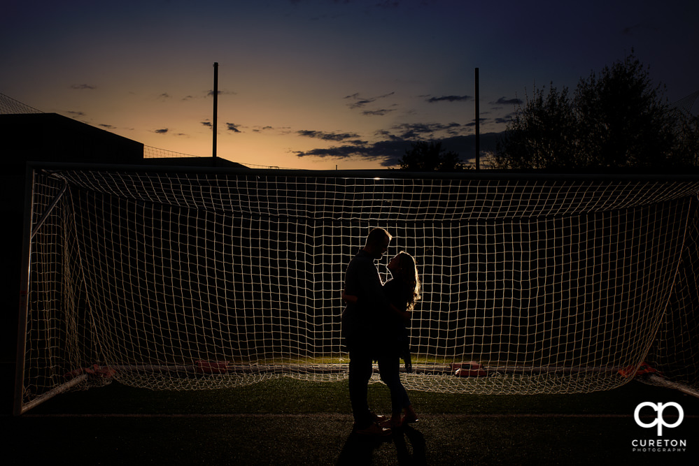 Future bride and groom having an engagement session in downtown Greenville SC at Falls Park.