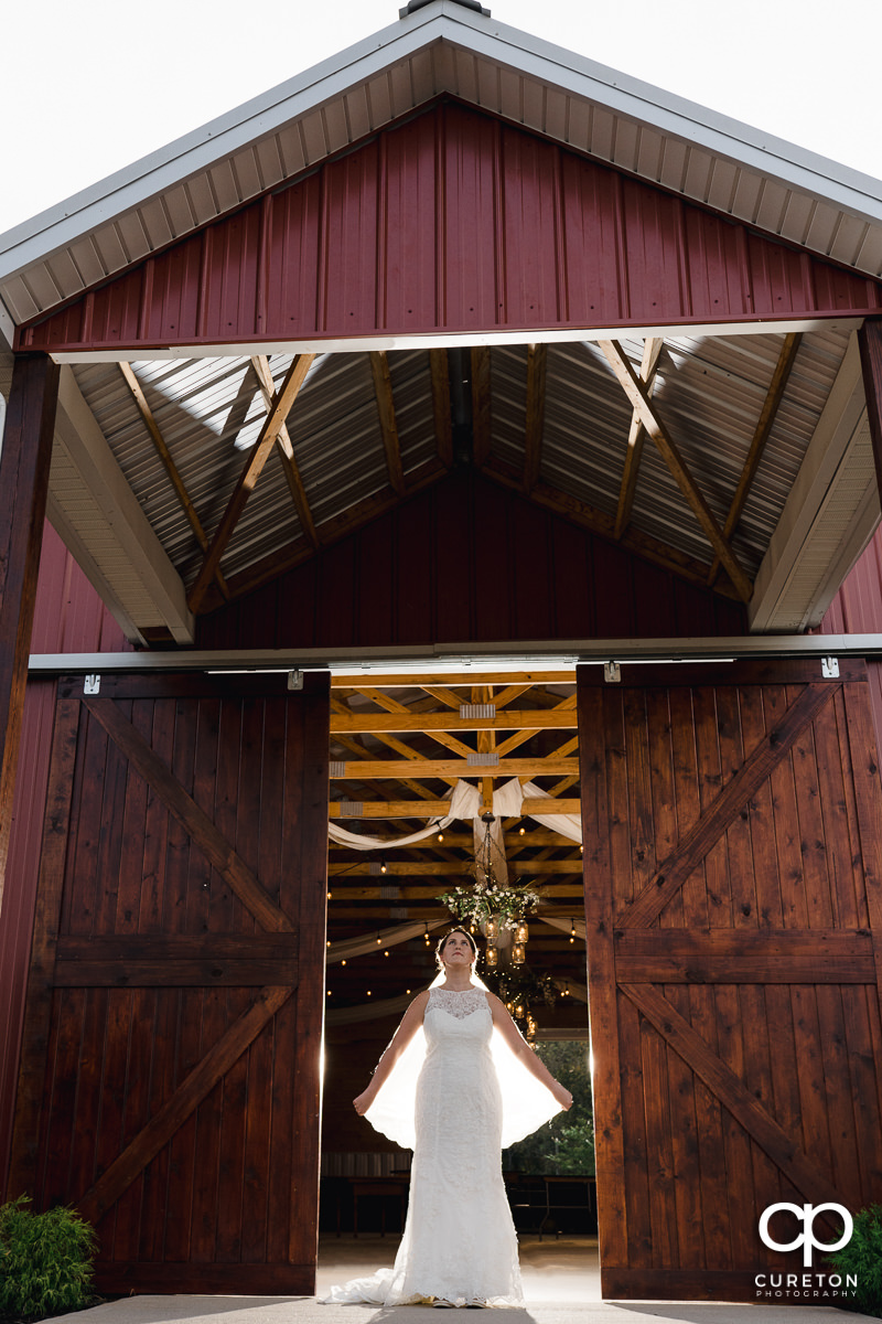Bride inside the main barn during a pre wedding bridal session at Famoda Farms in Taylors,SC.