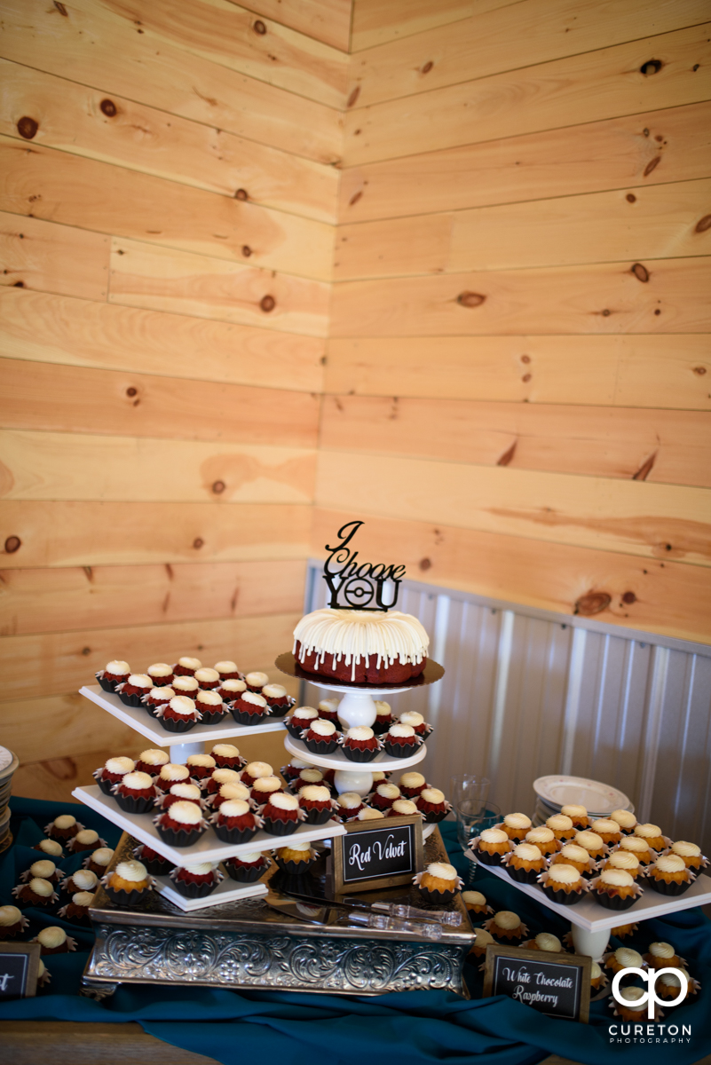 Wedding cake and cupcakes.